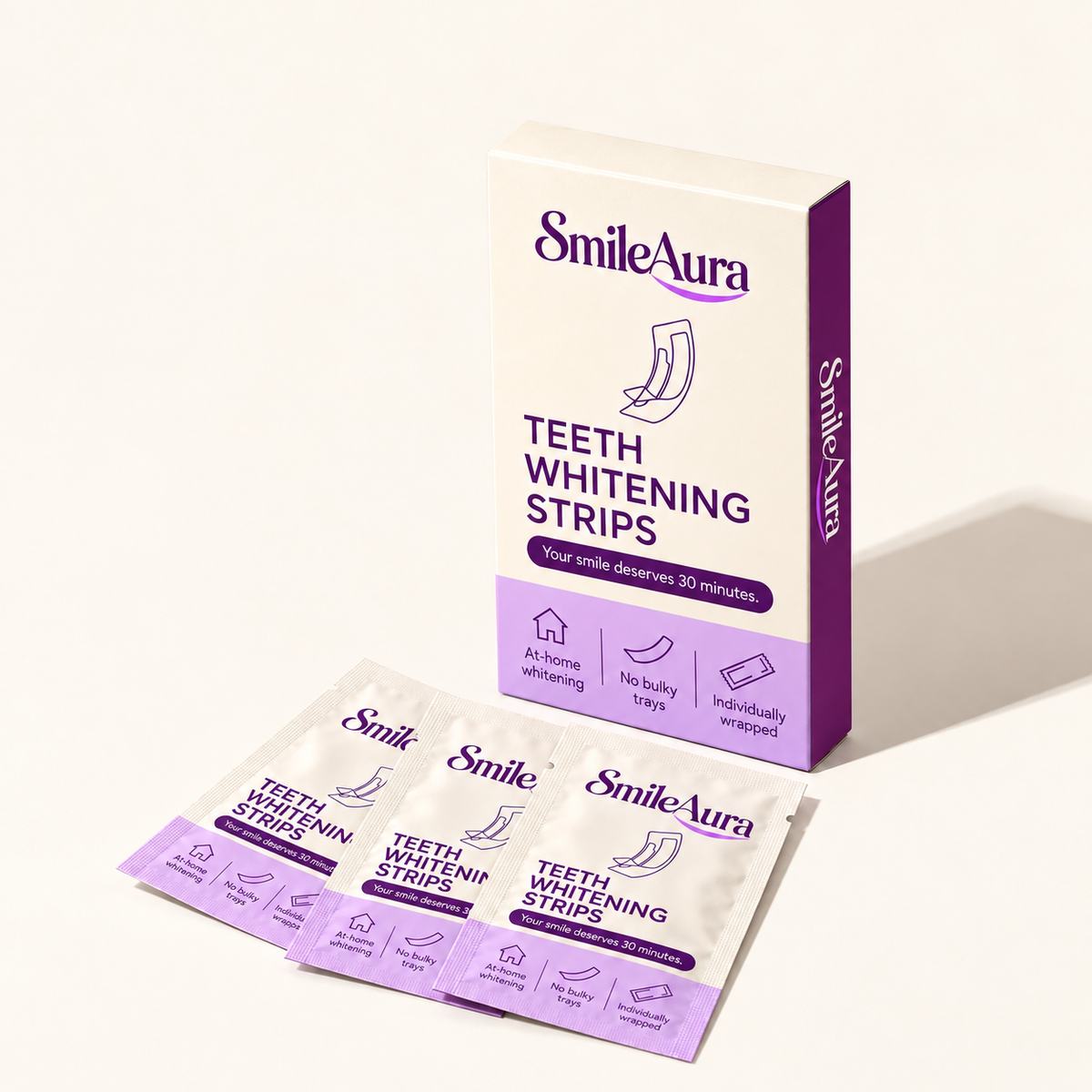 SmileAura PAP strips box and three sachets on warm cream background